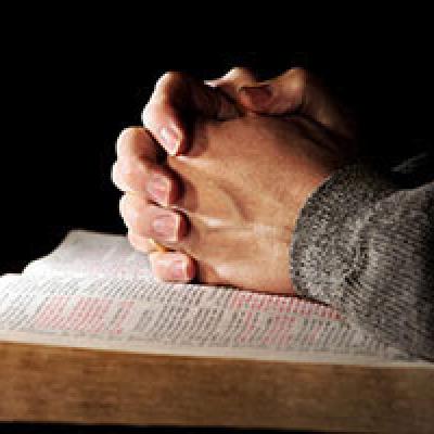 bible and hands